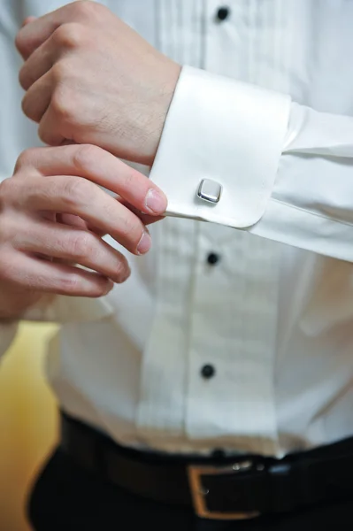 Close-up of elegance groom hands with cufflink — Stock Photo, Image