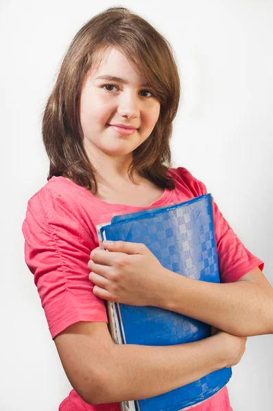 किशोर लड़की का चित्र सफेद पृष्ठभूमि पर अलग किताबें रखता है — स्टॉक फ़ोटो, इमेज