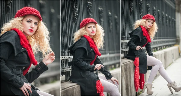 Attractive young woman in a winter fashion shot. Beautiful fashionable young girl with red umbrella in the street — Stock Photo, Image