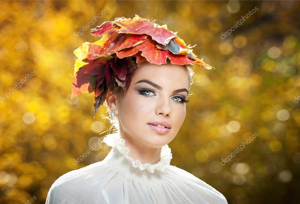 Autumn Woman. Beautiful creative makeup and hair style in outdoor shoot ...