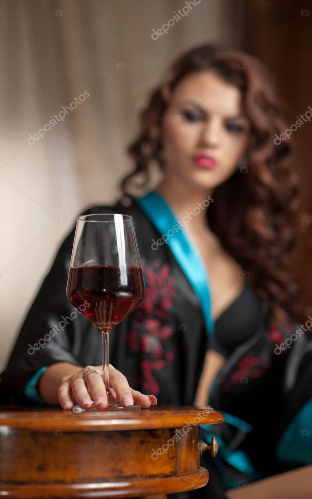 Beautiful Sexy Woman With Glass Of Wine Sitting On Chair Portrait Of A Woman With Long Curly