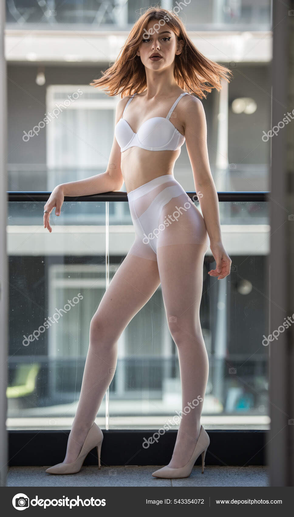 Attractive Woman White Pantyhose High Heels Long Legs Posing Challenging  Stock Photo by ©iancucristi 543354072