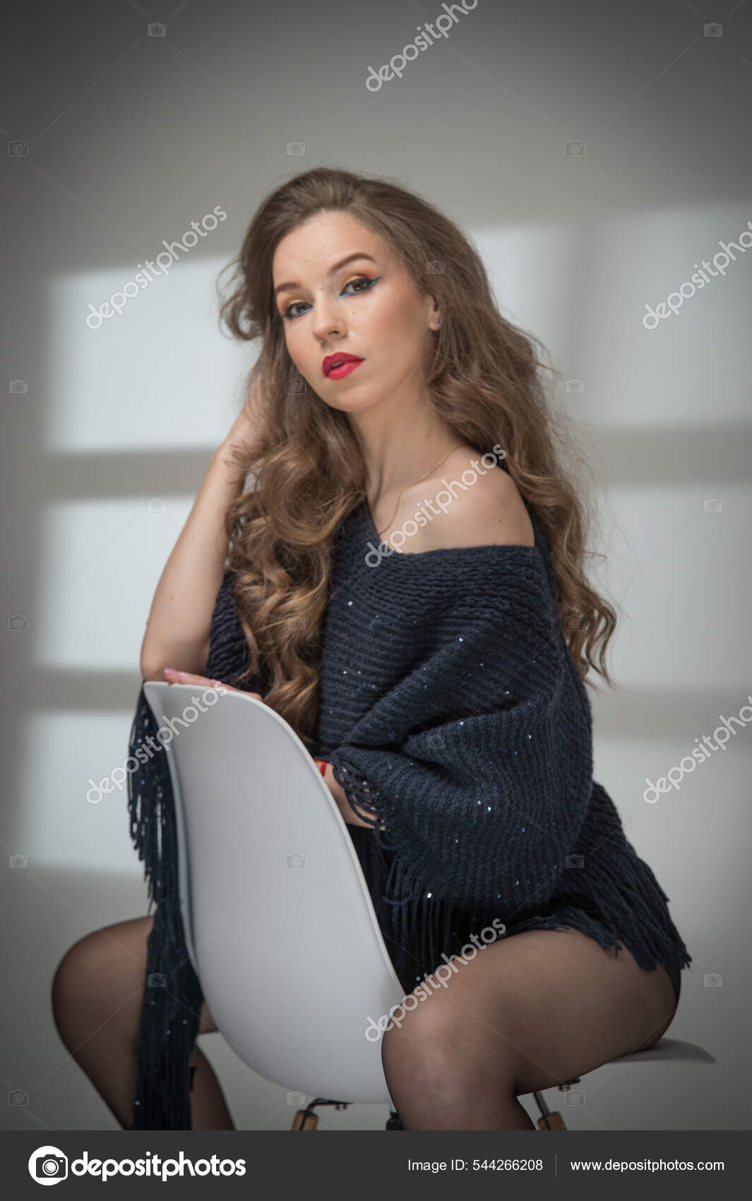 Sexy Beautiful Woman With Long Hair And A Black Transparent Pantyhose Lying  On A Sofa Stock Photo, Picture and Royalty Free Image. Image 146133824.