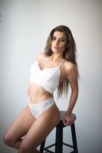 Attractive Sexy Brunette White Lingerie Posing Provocatively Front Wall Studio — Stockfoto