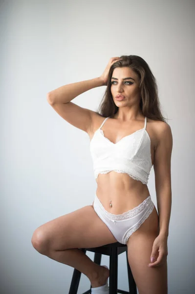 Attractive Sexy Brunette White Lingerie Posing Provocatively Front Wall Studio — Stockfoto