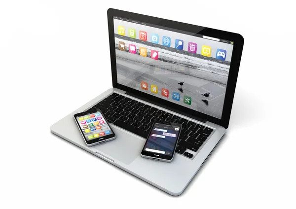 Laptop en twee smartphones — Stockfoto