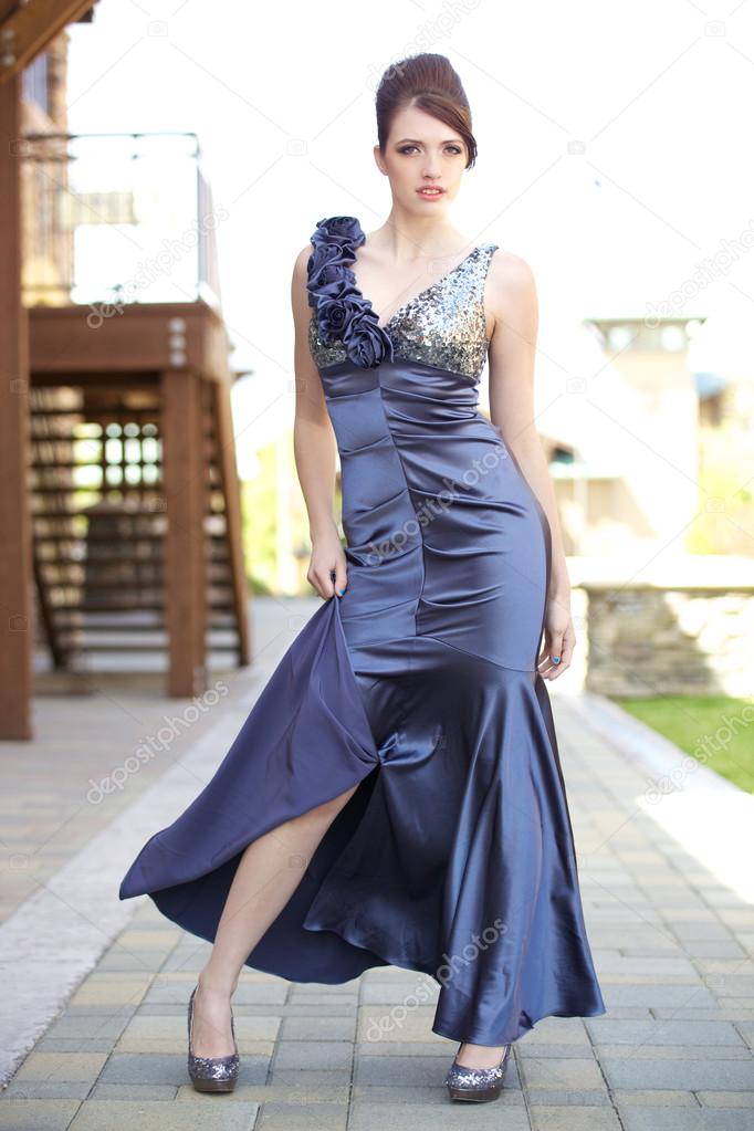 Beautiful Fashion Model Standing Pose with Formal Dress Outdoors