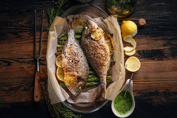Concept Delicious Dinner Two Dorado Baked Dorado Fish Asparagus Lemon Stock Photo