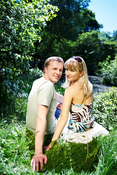 Lovers couple on the shore of the pond Stock Image