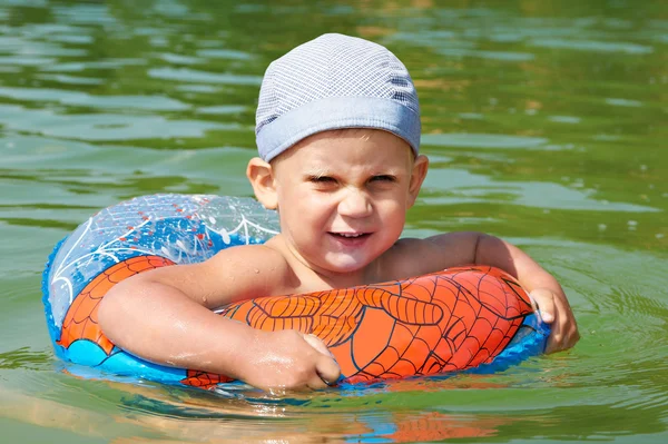 Happy boy with a rubber ring — Stock Photo, Image