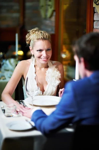 Loving couple at a table in restaurant — Stock Photo, Image
