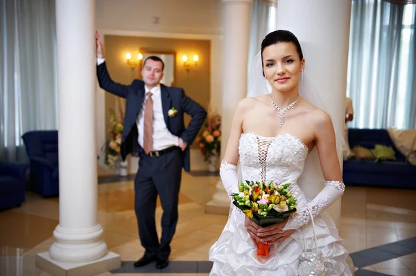 Happy bride and groom in wedding palace — Stock Photo, Image