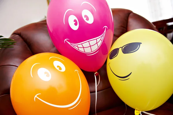 Three fanny multicolored balloons — Stock Photo, Image