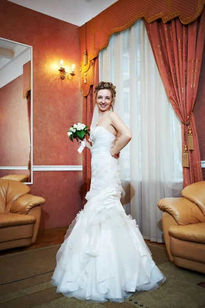 Happy beautiful bride in interior wedding palace — Stock Photo, Image
