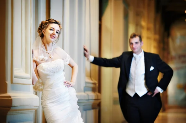 Stylish bride and groom in interior — Stock Photo, Image