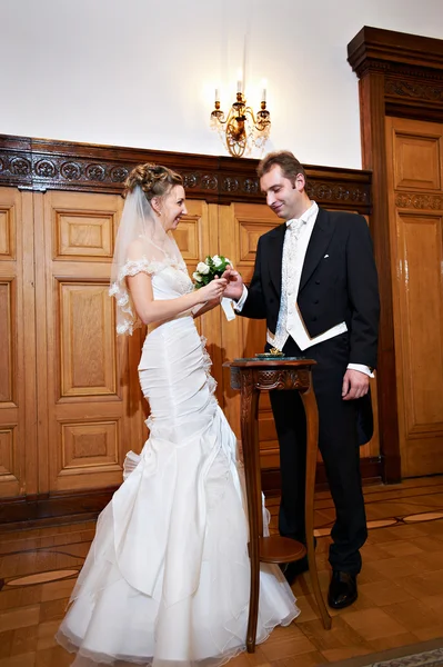 Joyful bride and groom at the ceremony of marriage registration — Stock Photo, Image