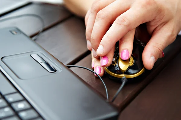 Female and male hands on computer mouse near the notebook — Stock Photo, Image