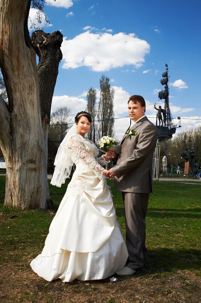 Happy bride and groom at a wedding walk — Stock Photo, Image