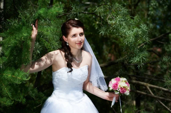 Happy bride with bouquet — Stock Photo, Image