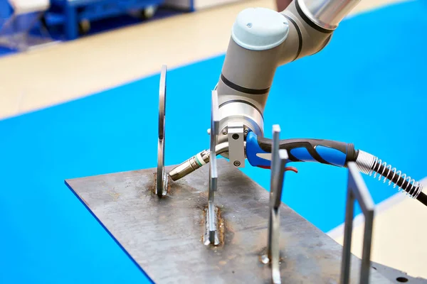 Robot manipulator arm with welding on exhibition