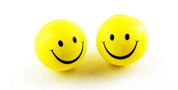 Rostos amarelos sorridentes — Fotografia de Stock