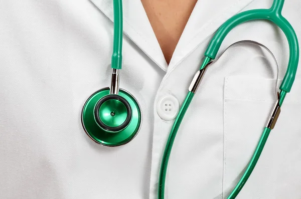 Doctor with a green stetoscopio — Stock Photo, Image