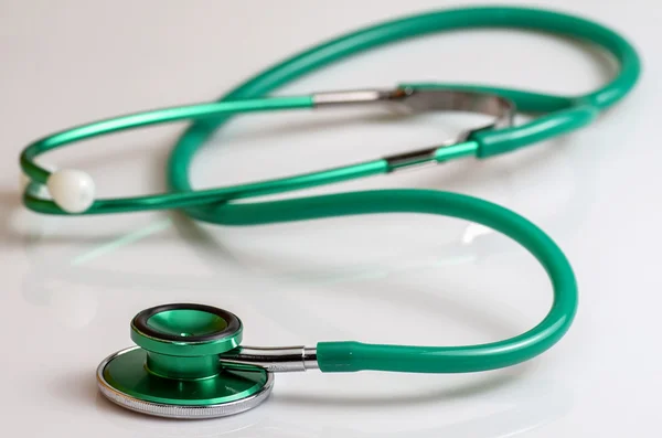 Horizontal green stethoscope — Stock Photo, Image