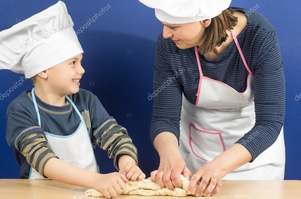 mother and son making a pizza