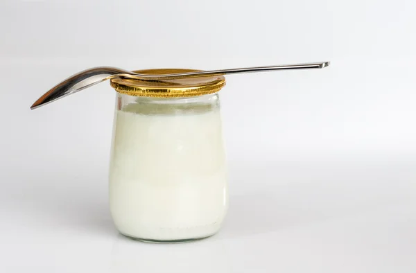 Yogurt with spoon 1 — Stock Photo, Image