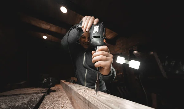 Man Works Drill His Workshop Carpenter Drills Hand Power Tool — Stock Photo, Image