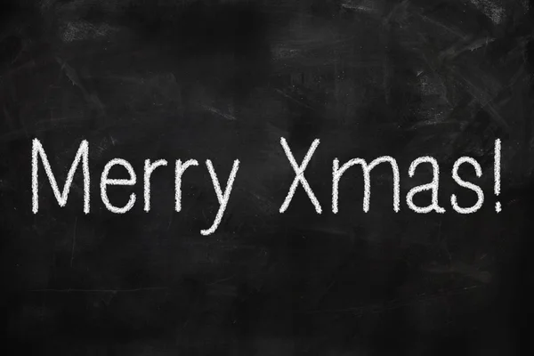 Frohe Weihnachten auf Schultafel geschrieben — Stockbild Frohe Weihnachten geschrieben — Stockfoto