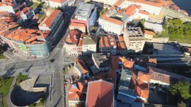 A camera drone flies backward over Porto Cathedral and the former bishops' residence, Portugal
