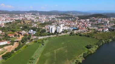 An aerial view of Coimbra (Portugal) residential districts on the right bank of Mondego River and surrounding mountains