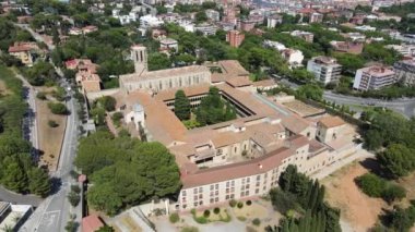 A camera drone flies around the Monastery of Pedralbes, Barcelona, Spain