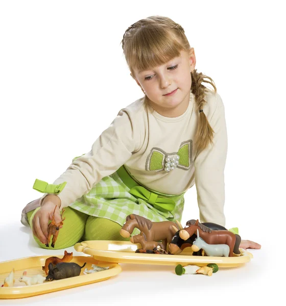 Nice little girl playing with — Stock Photo, Image