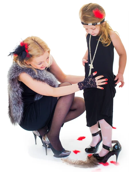 Feliz madre e hija jugando sobre el fondo blanco — Foto de Stock