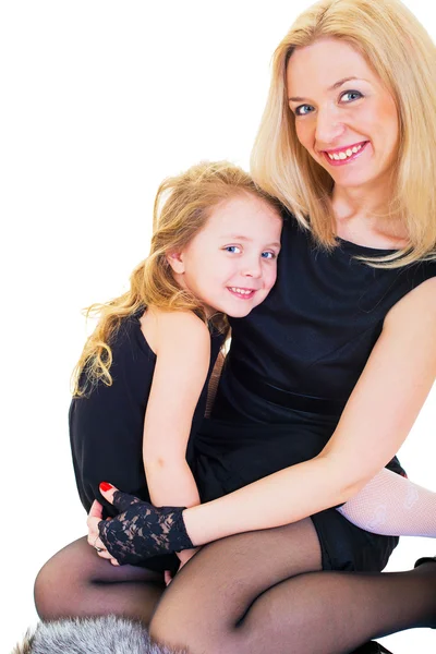 Feliz madre e hija jugando sobre el fondo blanco — Foto de Stock