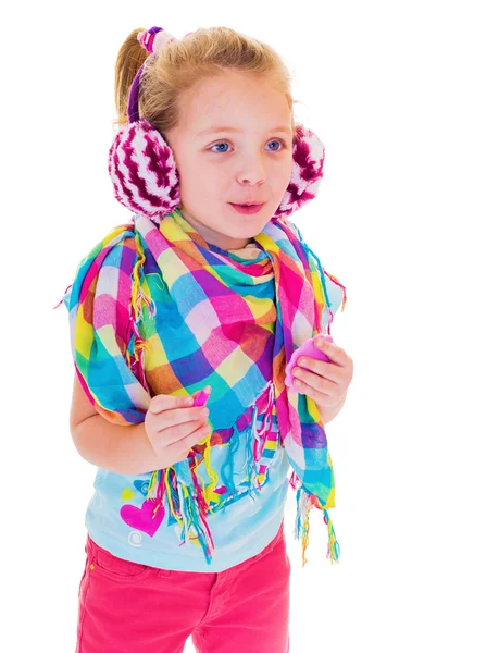 Het meisje in warme oortelefoons — Stockfoto