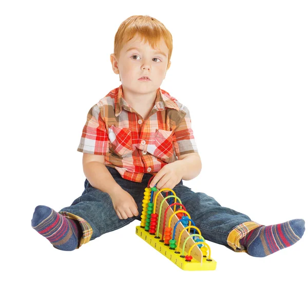 Little boy engaged in Montessori materials — Stock Photo, Image