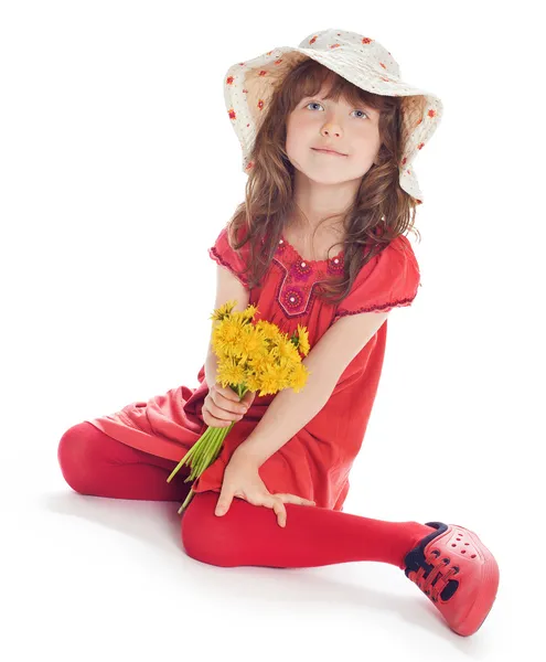 Girl in a hat with flowers — Stock Photo, Image