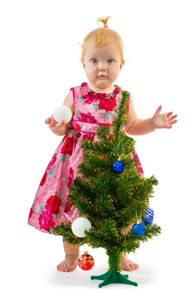 Pretty little girl near the new year tree — Stock Photo, Image