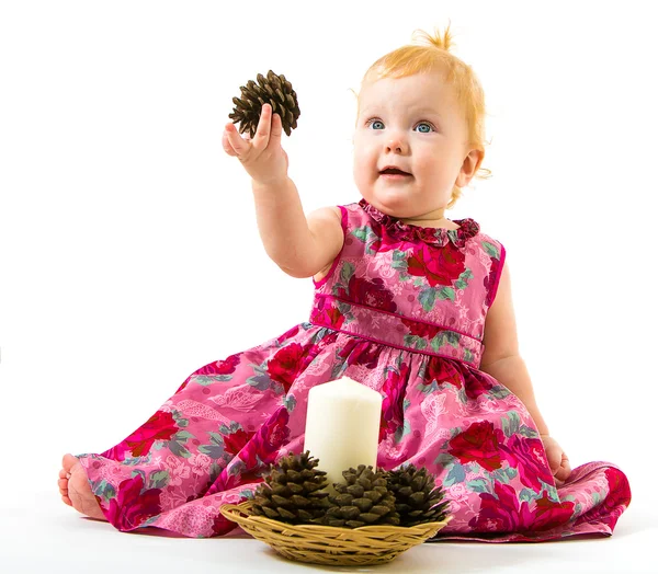 Charming little girl in a Christmas candle in hand with a bump — Stock Photo, Image