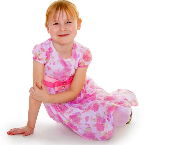 Bambina in un abito rosa elegante . — Foto Stock