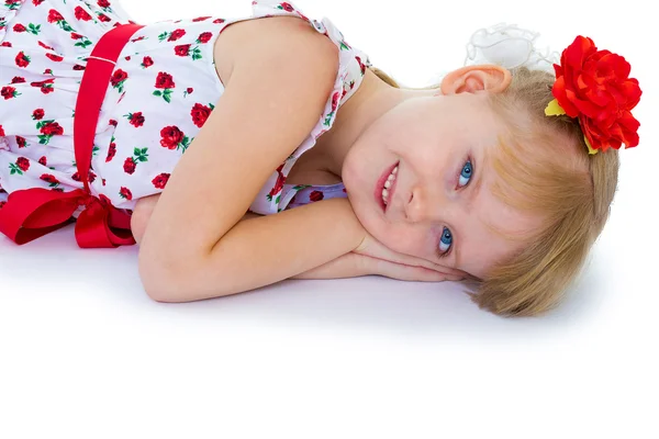 Beautiful little girl with a smile looking — Stock Photo, Image