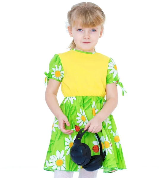 Very musical little girl having fun listening to music through t — Stock Photo, Image