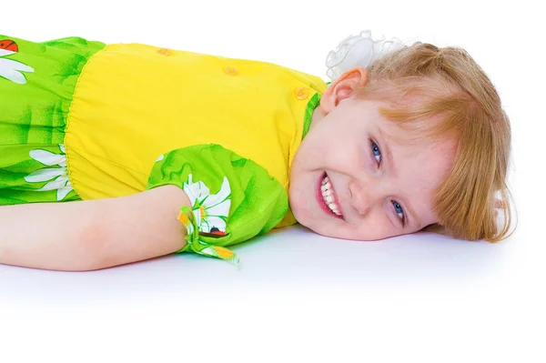 Very beautiful little girl in a green summer dress fun posing st — Stock Photo, Image