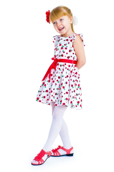 Charming little girl standing leg thrust forward and have fun lo — Stock Photo, Image