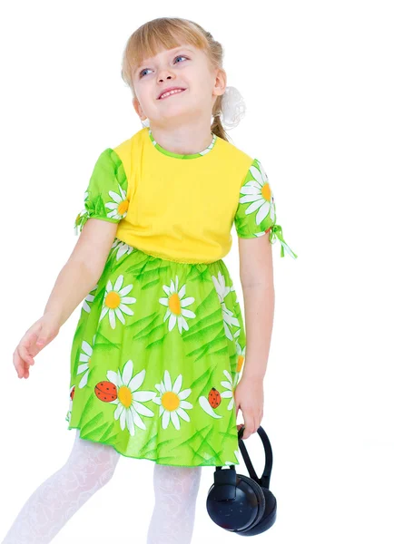 Charming little girl loves to listen to music through headphones — Stock Photo, Image