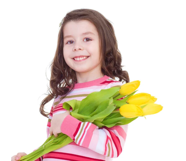 Encantadora niña con tulipanes amarillos . — Foto de Stock