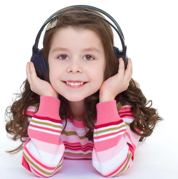 Hermosa linda niña feliz con auriculares . — Foto de Stock